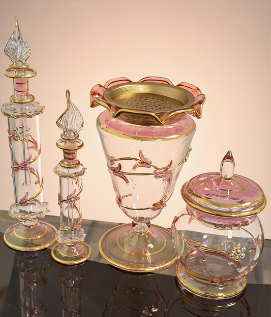 Ward rose glass mabkhara with ruffled gold rim, lidded jar and attar bottles with spire stoppers