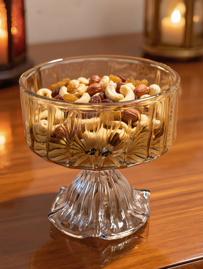 Amber hand-blown glass footed bowl filled with mixed nuts for Ramadan