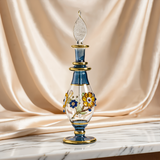Tall blue and gold hand-blown Egyptian glass decanter on ivory satin drape