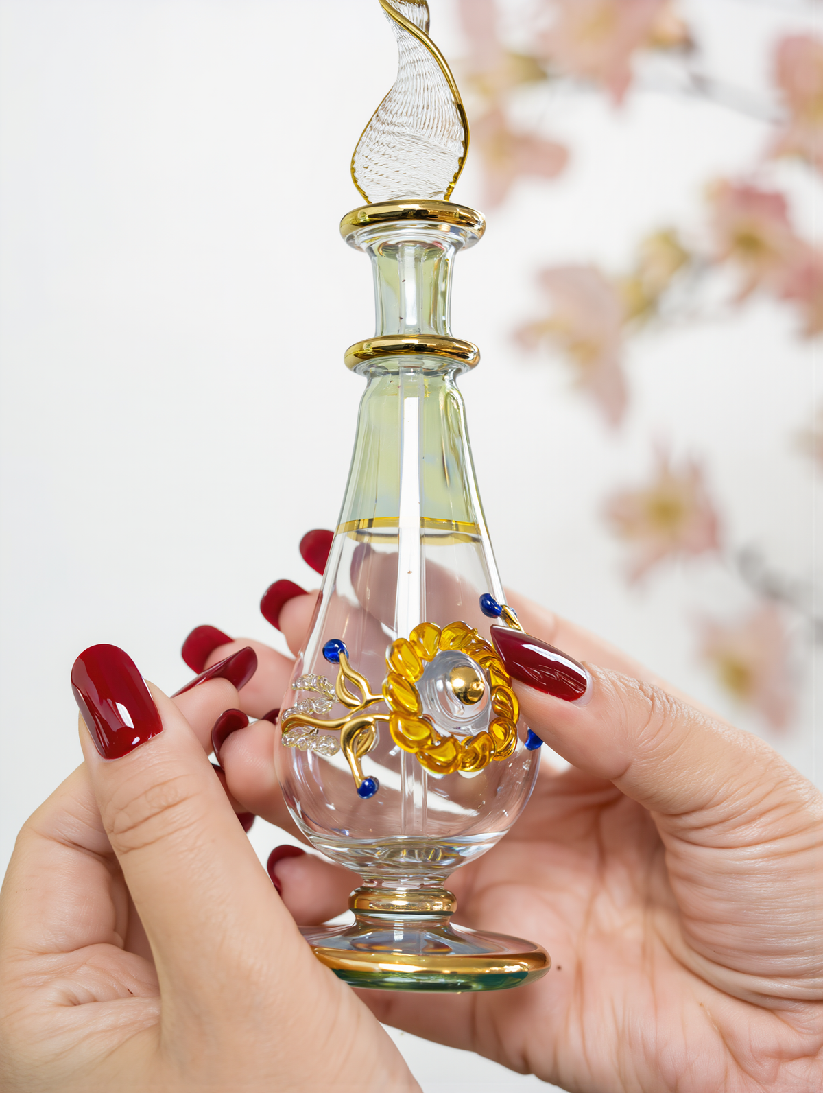 Close-up of 24K gold detail on a hand-blown sample bottle